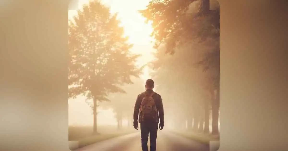 A solitary person walking down a quiet road at sunrise, symbolizing the lonely journey of personal growth