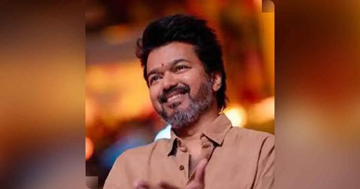 Thalapathy Vijay with fans cheering in background