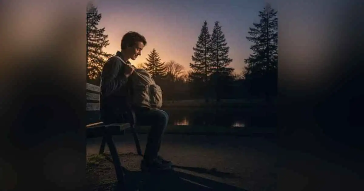A person sitting quietly with a heavy heart while smiling on the outside