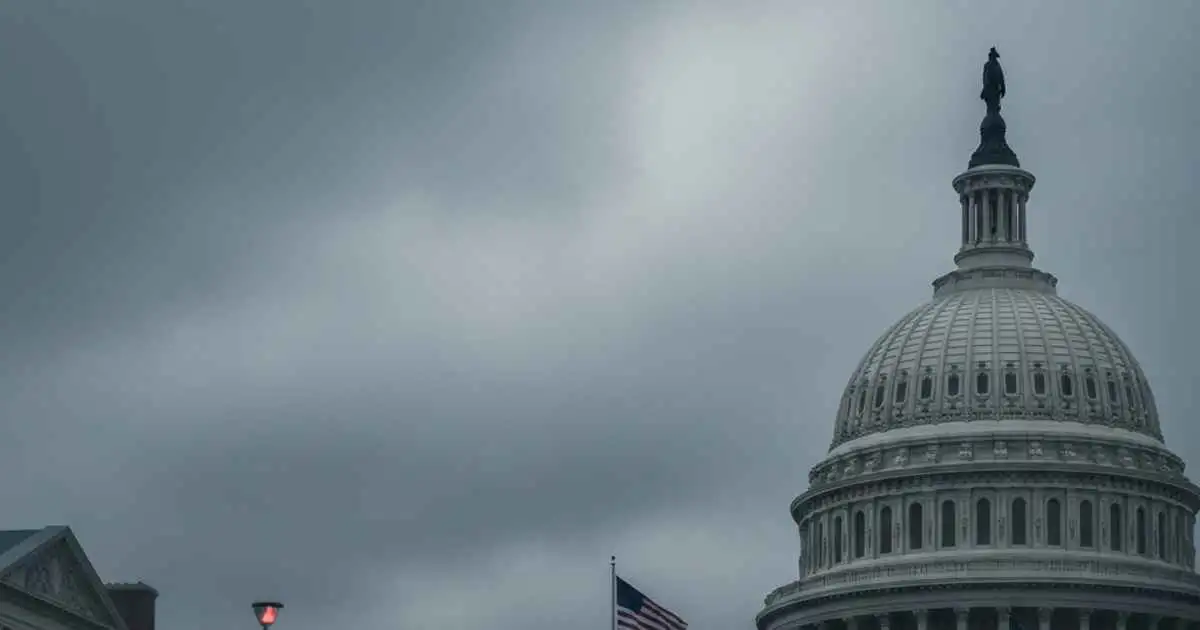 US Capitol and university campus under a tense, overcast sky symbolizing immigration policy debate